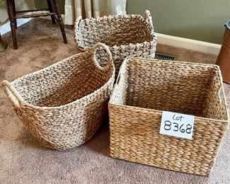 Lot 8368. $65.00 Lot of 3 Woven grass baskets with handles. 1) 16" x 14" x 12" T, 2) 15" x15" x 14" T, 3) 17" x 11" x 15.5" T