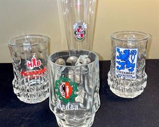 Lot 8375.$48.00 Lot of 5 Glass Mug Beer Steins and 1 Pilsner Glass adorned with Logos for Beer Companies.