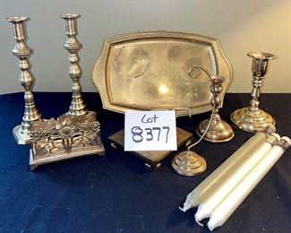 Lot 8377. $50.00 Lot of brass items: 10 tray 14" x 9", 2) brass stand 5" x 5", 3) brass letter/napkin holder 5.5" x 2" x 3" T, 4) pair of brass candle sticks 10" T, 7" candlestick, 5" candlstick, 5). ornament holder 8" T, 6) 4 Northern Lights candles.