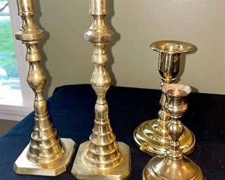 Lot 8377. $50.00 Lot of brass items: 10 tray 14" x 9", 2) brass stand 5" x 5", 3) brass letter/napkin holder 5.5" x 2" x 3" T, 4) pair of brass candle sticks 10" T, 7" candlestick, 5" candlstick, 5). ornament holder 8" T, 6) 4 Northern Lights candles.