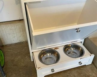 Doors open and dog water and food dish
