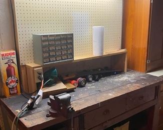 Sturdy old work table with drawers, shelfand vise