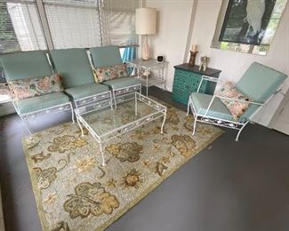 Wonderful vintage patio furniture. Includes four chairs, coffee table and end table. The coffee table measures 34.5" x 24.5" x 16" and the chairs are 30" h. Currently used in a seasonal enclosed porch, so has not been used outside. Only includes the furniture and cushions. Other decorative items in the photos are not included.