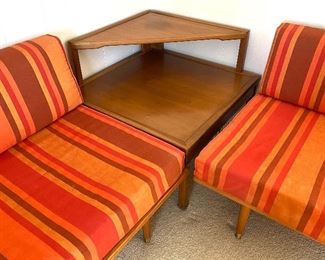 AMAZING! Mid Century Corner Sectional. Under the cushions has the name of Sengweb Sagless Construction. Upholstered in a wonderful striped red and orange fabric.
Each side measures about 75" x 30" and the corner table is 43" d x 42" w
The Foam cushions are in as-is condition and will likely need to be replaced