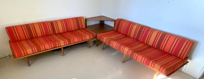 AMAZING! Mid Century Corner Sectional. Under the cushions has the name of  Sengweb Sagless Construction. Upholstered in a wonderful striped red and orange fabric. 

Each side measures about 75" x 30" and the corner table is 43" d x 42" w 

The Foam cushions are in as-is condition and will likely need to be replaced