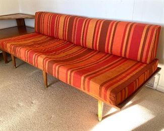 AMAZING! Mid Century Corner Sectional. Under the cushions has the name of Sengweb Sagless Construction. Upholstered in a wonderful striped red and orange fabric.
Each side measures about 75" x 30" and the corner table is 43" d x 42" w
The Foam cushions are in as-is condition and will likely need to be replaced