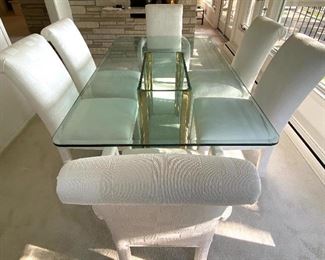 Contemporary Style Dining Room Table w/ Six Upholstered Chairs in very good condition.
Table measures 6' x 42" and the chairs are 38" h.