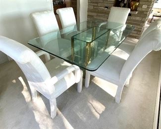 Contemporary Style Dining Room Table w/ Six Upholstered Chairs in very good condition.
Table measures 6' x 42" and the chairs are 38" h.