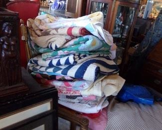 STACKS OF QUILTS AND QUILT TOPS. QUILTS START IN AT $45.00 EACH. QUILT TOPS START IN AT $35.00 EACH.