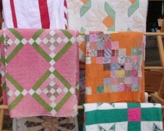 ASSORTED QUILTS AND QUILT TOPS.
