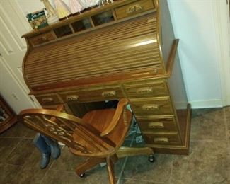 Oak roll top desk with built-in lamp; set of keys included.

Also available: coordinating rolling chair