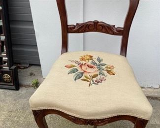 Rosewood carved chair with needlepoint upholstery