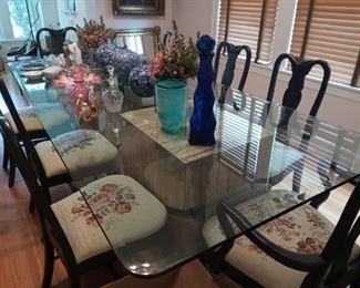 Exceptionally large, thick beveled glass top has served as the family dining table. 108" x 48" seats up to 10. Rests on faux stone cubes that are lightweight. We do not provide moving service.