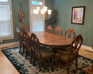 Solid Oak Dinning Room Table - 2 - 18 leaves, 2 arm chairs, 6 regular chairs - 7 ft-8 in x 48 - $ 1000.00 includes Hutch