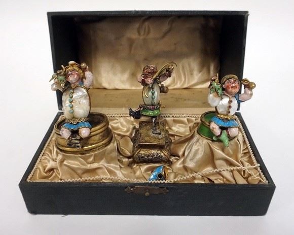 1001	3 COLD PAINTED BRONZE FIGURES OF JESTERS WITH MOTHER OF PEARL AND STONE. CENTER NEEDS TO BE REATTACHED. 3 IN HIGH
