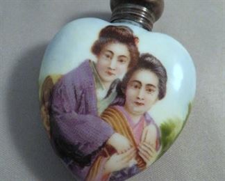 Sweet heart shaped porcelain scent bottle with sterling silver cap depicting (2) Japanese women in embrace