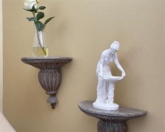 Wall sconces; floral arrangement, alabaster statue