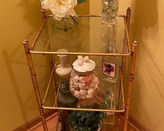 3 tier glass accent table with decorative accessories