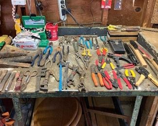 Large variety of handtools including pliers, screwdrivers, wire strippers, chisels, wire brushes and steel wedges