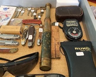 Jack knives, Antique marine telescope, sunglasses camera light meter and skeleton keys