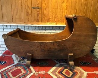 Antique Rocking infant Cradle is nicely carved. Believe this is walnut
45x20x28