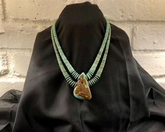 Vintage Turquoise with sterling clasp.