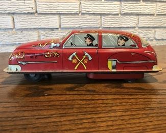 Vintage Tin Litho Friction Drive Fire Chief Car By Lupor Metal Products, USA. Includes internal friction drive mechanism.
About 8.5in long