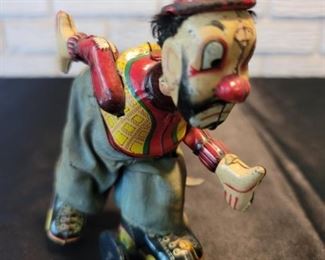 Japan Tin Toy Wind Up Clown on Roller Skates