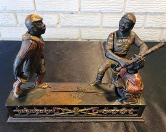 Dark Town Battery" Baseball Cast Iron Mechanical Black Americana Bank.  By J.E. Stevens in 1888
7in tall and 9.75in long�