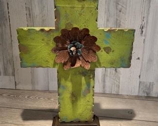 Wooden cross with flower made out of tin