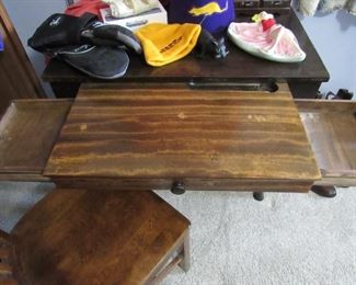 Antique desk and chair with pull out writing surface and hidden drawers