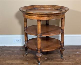 GUERIDON TABLE | Round side table with four turned wood legs on casters, three tiers, top surface has framed lip edge; made in Indonesia by Milling Road, a division of Baker Furniture; h. 27-1/2 x dia. 26 in.