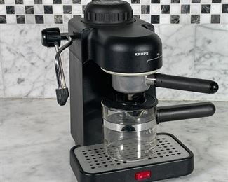KRUPS ESPRESSO MACHINE | Krups Type 963 four cup espresso maker, with milk frother, powers on ; h. 11 x 7-1/2 x 9 in. 