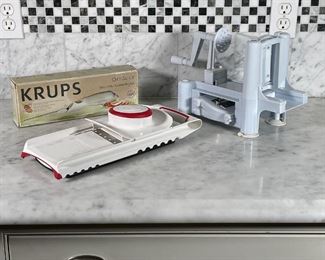 (2pc) CUTTING APPLIANCES | Including Krups OptiSlice electric knife in original box (untested), Spiralizer by Palermo (l. 15 in.), and Leifheit mandoline slicer (l. 15 in.) 