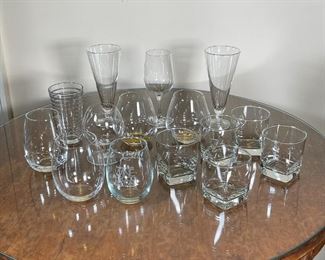 (15pc) ASSORTED GLASSWARE | Including a solo Baccarat cognac glass (4-3/4 in.), six mixed wine glasses one with stem, pair tall drinking glasses (7 in.), solo ribbed drinking glass, and five short drinking glasses 