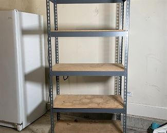 SHELVING UNIT | 5 tiered industrial shelving unit with plywood boards and metal frame; h. 72 x 36 x 18 in. lower shelf warped 