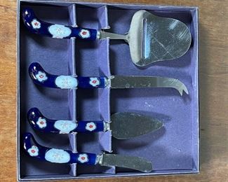 PRILL CHEESE KNIFE SET | Porcelain handles with floral designs and gilt accents, in original box; 8-3/4 x 9-1/4 in. 
