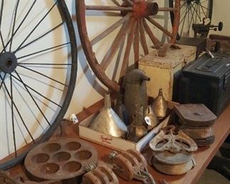 Wagon Wheels, pulleys, ammo boxes, and cast iron.