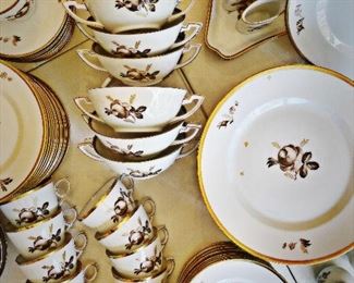 13 Dinner Plates, 14 Cream Soups with 13 Stands, 13 Cups and 12 Saucers, 7 Misc. Saucers, 13 Salad Plates, 9 Bread and Butter Plates, 2 Pairs of Salt Shakers, 1 Pair of Pots de Cremes, 2 Triangular Dishes, 1 Pair of Oval Cigarette Cups. 