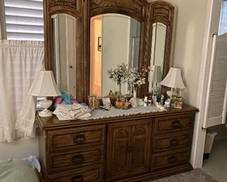 Dresser Drawers with Mirror, Hobnail Milk Glass Vanity Lamps, Assorted Perfumes, Toiletries