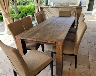 Outdoor Table with 10 Chairs (This is from Crate and Barrel) It is actually an indoor set but my client has it under canopy where is a like new