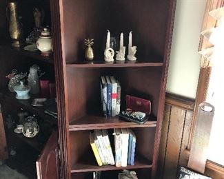 entertainment center with books and figurines