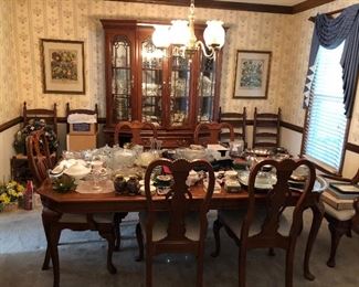 Gorgeous dining set table and chairs with hutch. Extra dinner chairs and many lovely dishes and accessories