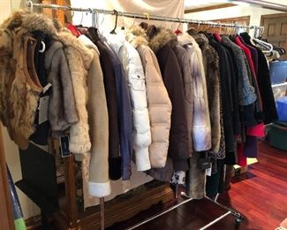 so many clothes - many with tags - coats/faux furs