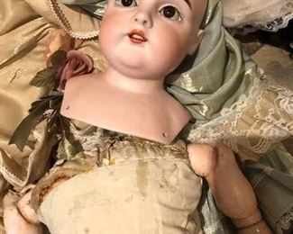 antique German doll with bisque head and mixed composition / leather body