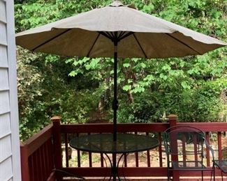 Black Wrought Iron Round Patio Table and 2 Chairs with Tan Outdoor Umbrella and Base and End Table