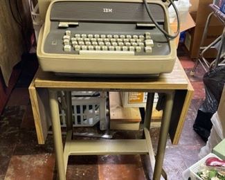 Vintage IBM typewriter with rolling desk.