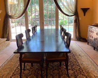Extendable Mahogany Dining Table from Bloomingdales.  Please see next photo. Closed to smaller table size.   Oriental rug 9'x12' available for sale along with 2 custom accent chairs w/gold/rust brocade fabric and fringe.