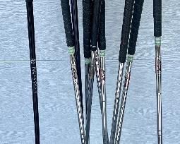 Assorted golf clubs