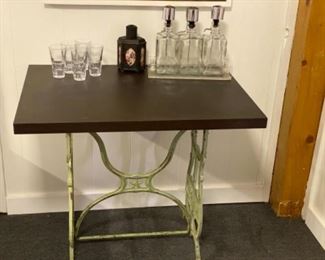 Fun entry or bar table made from old sewing machine base